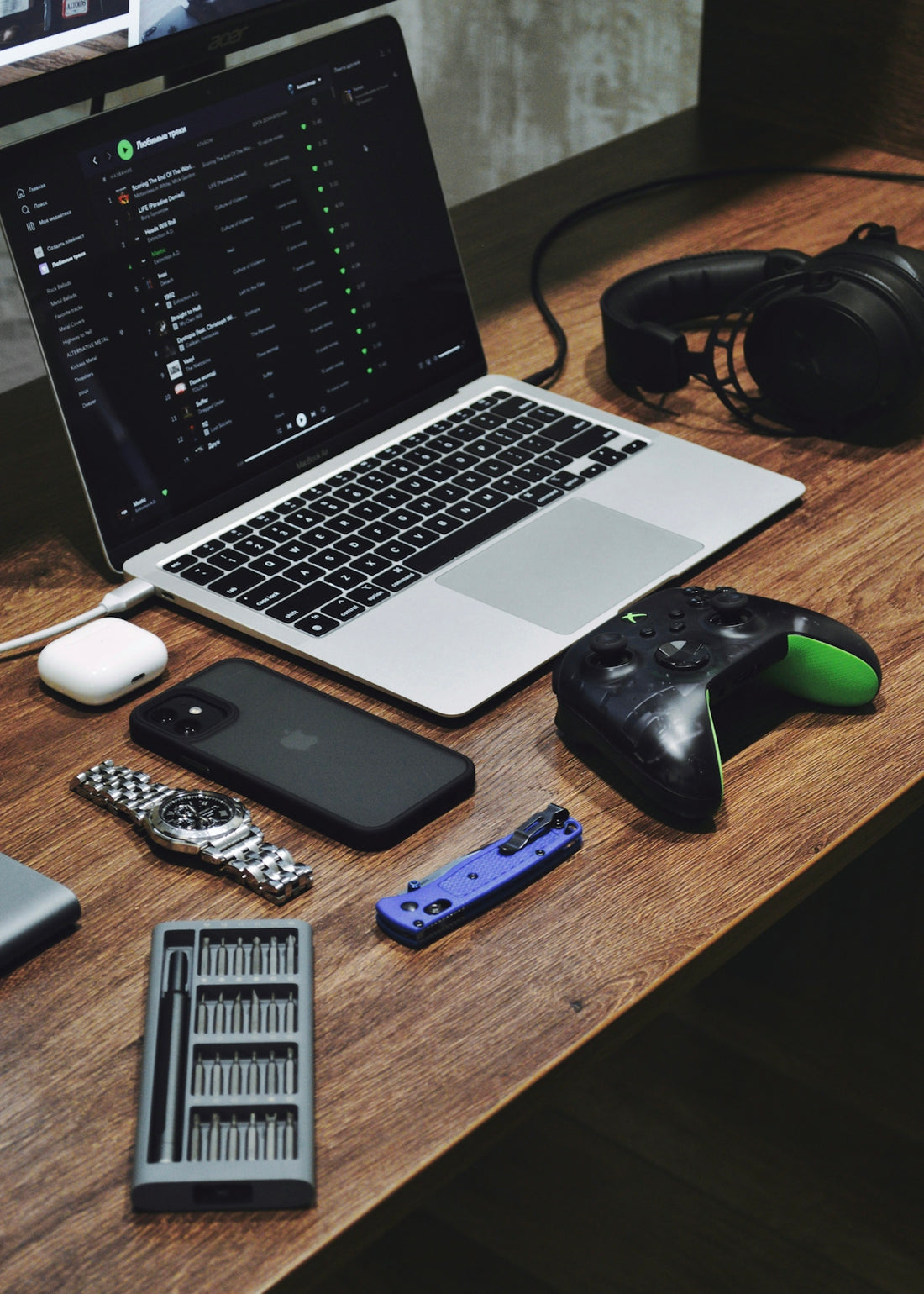a laptop computer sitting on top of a wooden desk