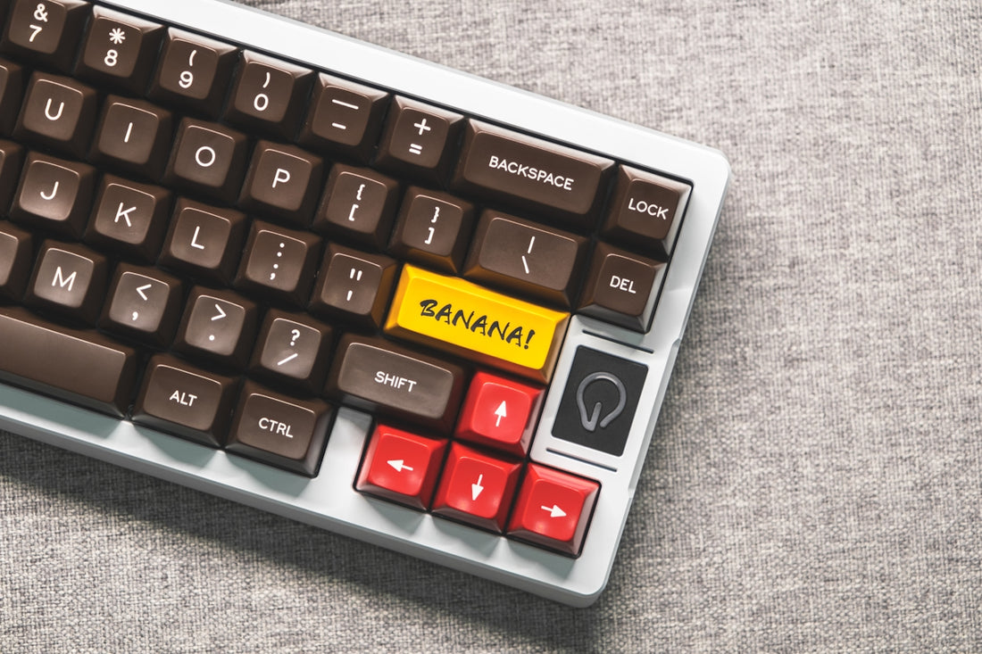 a keyboard with a yellow sticker on it