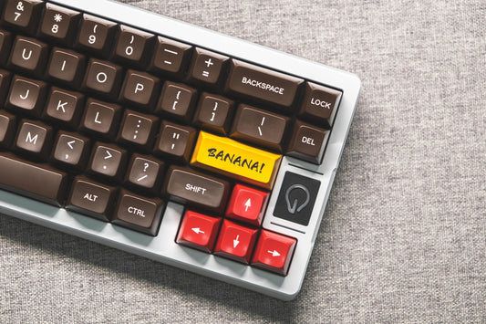 a keyboard with a yellow sticker on it