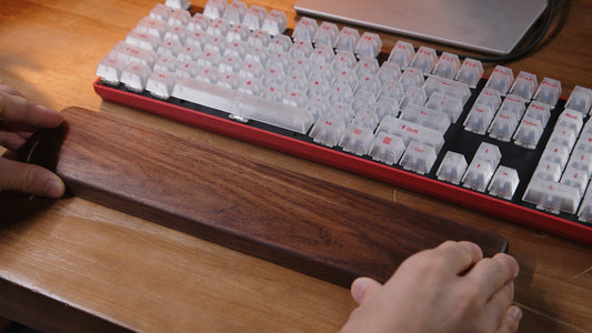 A person is typing on a computer keyboard